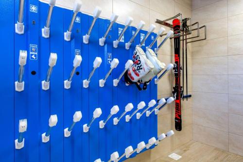 a hockey room with a bunch of hockey sticks at Apartmány Roháče in Zuberec