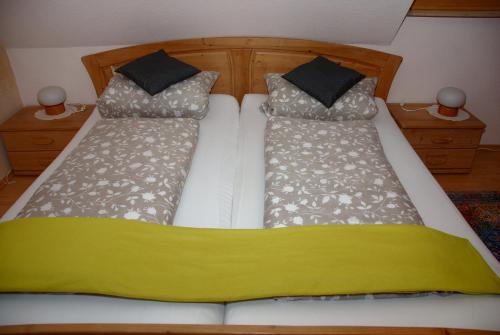 Postel nebo postele na pokoji v ubytování ambiente solutions apartments