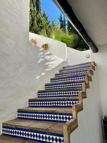 a set of stairs with blue and white tiles at El Molino Estepona in Estepona
