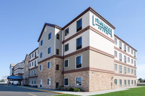 a rendering of the front of the student union building at Staybridge Suites Lincoln North East by IHG in Lincoln