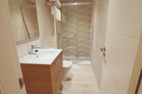 a bathroom with a toilet and a sink and a shower at Poeta 1 Bedroom Apartment IHAEP11119 in Fuengirola