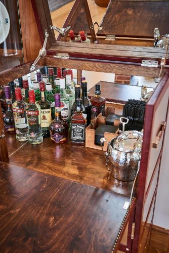 a group of bottles of alcohol sitting on a counter at Staybridge Suites Liverpool by IHG in Liverpool