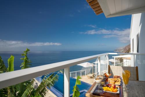 a view of the ocean from the balcony of a villa at Escarpa - The Madeira Hideaway in Ponta do Sol