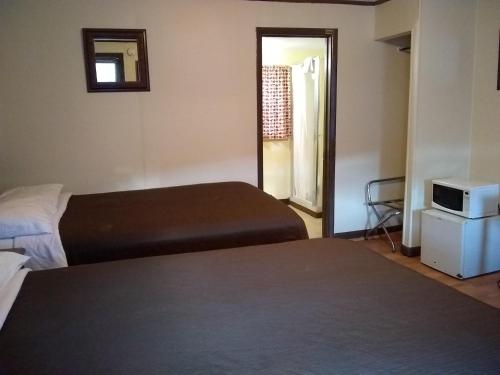 En eller flere senge i et værelse på Green Valley Motel Williamstown