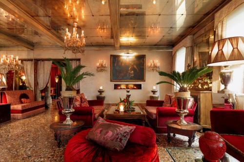 
a living room filled with furniture and decor at Hotel Metropole Venezia in Venice
