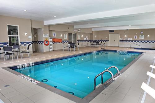 a large swimming pool with blue water at Comfort Inn & Suites in Kincardine