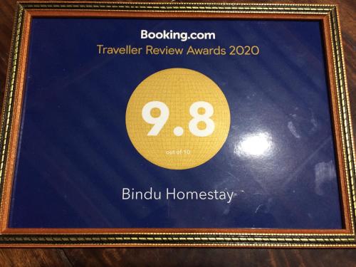 a framed picture of a sign with the number eight at Bindu Homestay in Wellawaya