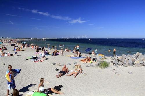 a large group of people on a beach at Revninge Guesthouse in Revninge
