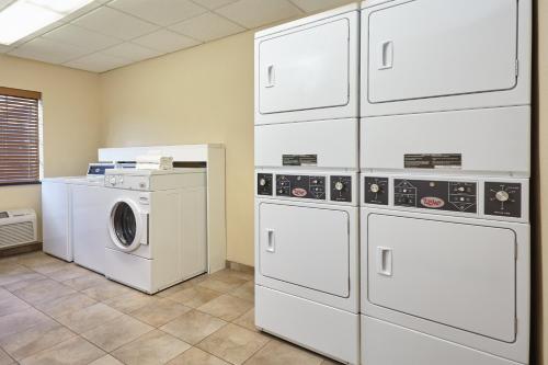 a laundry room with a washer and dryer at Candlewood Suites Aurora-Naperville by IHG in Aurora