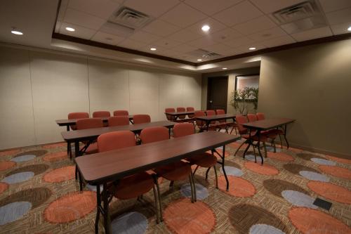 a conference room with tables and chairs in it at Staybridge Suites Montgomeryville by IHG in North Wales