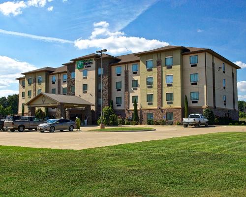 a large building with cars parked in front of it at Holiday Inn Express and Suites Heber Springs by IHG in Heber Springs