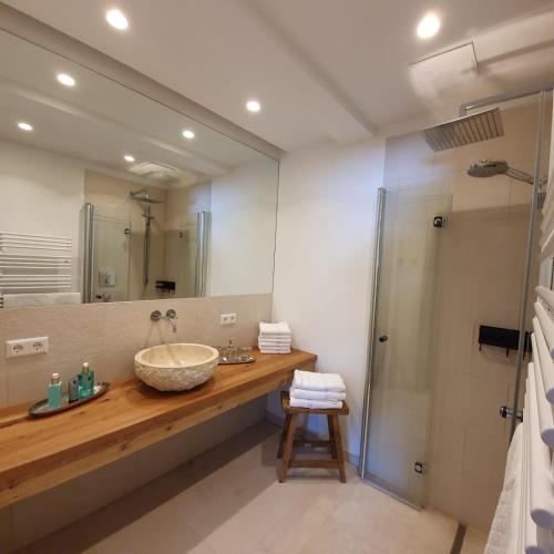 a bathroom with a large sink and a shower at Rocks Schladming in Schladming