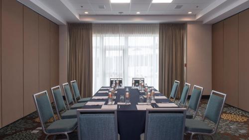 a conference room with a long table and chairs at Staybridge Suites Puebla by IHG in Puebla