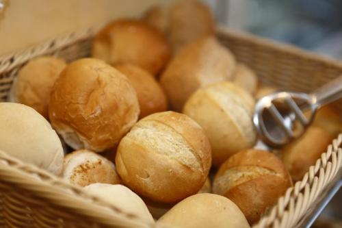 a basket filled with lots of loaves of bread at Hotel Estense in Modena