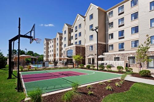 a basketball court in front of a building at Staybridge Suites Wilmington - Brandywine Valley by IHG in Glen Mills