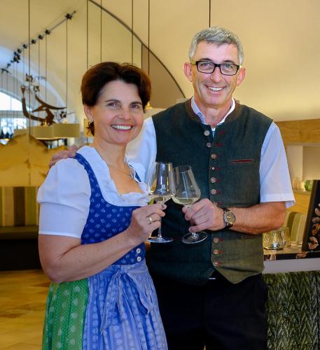 a man and a woman holding glasses of wine at Hotel Restaurant zur Post in Melk