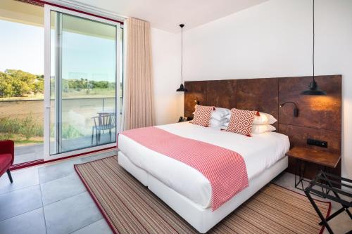 Uma cama ou camas num quarto em Hotel da Barrosinha