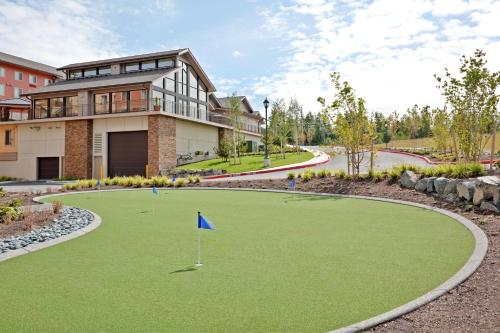 a golf course in front of a house at Staybridge Suites Everett - Paine Field by IHG in Mukilteo