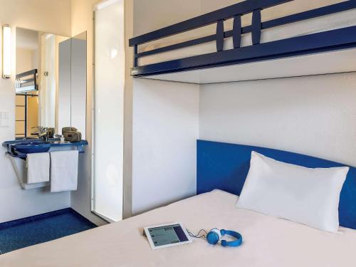 Postel nebo postele na pokoji v ubytování ibis budget Bar le Duc