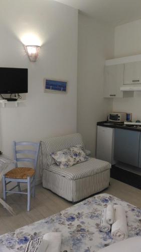 a living room with a couch and a table at Il Casalino Apartment in Pizzo