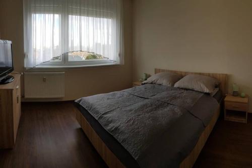 Postel nebo postele na pokoji v ubytování Chill Apartman