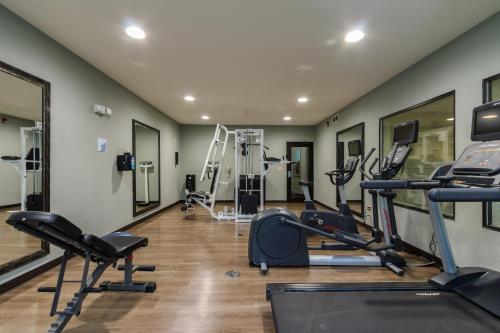a gym with several treadmills and elliptical machines at Holiday Inn Express & Suites - South Bend - Notre Dame Univ. in South Bend