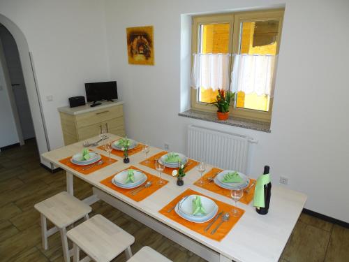 a table with plates of food on top of it at Ferienwohnungen Eva in Mühlbach am Hochkönig