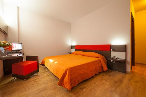 Postel nebo postele na pokoji v ubytování Hotel Plestina Ristorante Pizzeria