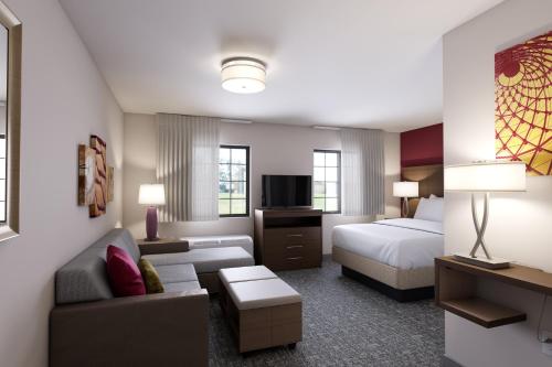 Ένα ή περισσότερα κρεβάτια σε δωμάτιο στο Staybridge Suites Detroit-Utica by IHG