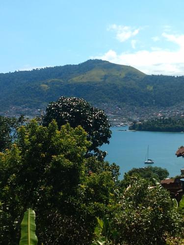 a view of a lake with a sail boat in it at Alto do Marinas in Angra dos Reis