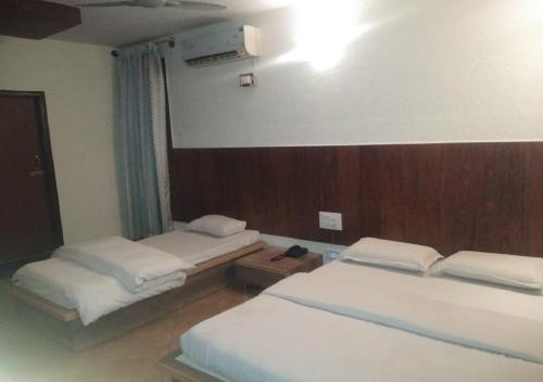 Voodi või voodid majutusasutuse Ocean Inn Hotels toas