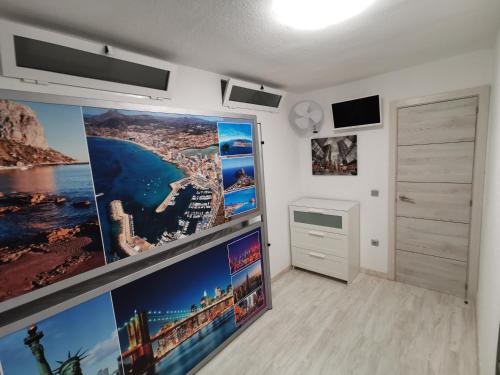 Televízia a/alebo spoločenská miestnosť v ubytovaní APARTAMENTO GALTOR 6