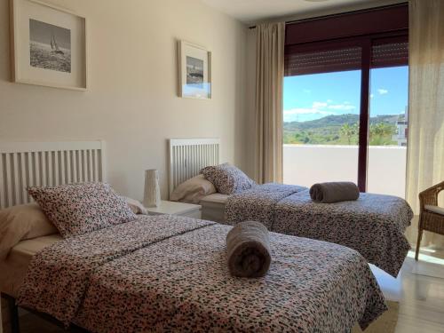 Postel nebo postele na pokoji v ubytování Apartamento en Magnifico Resort - Parque Botanico