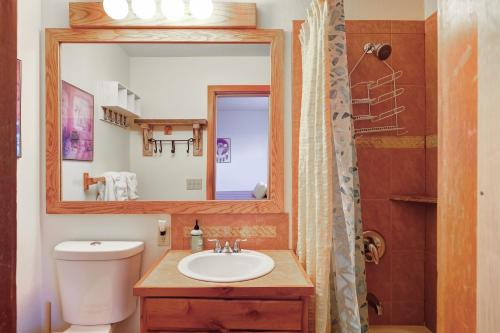 a bathroom with a sink and a mirror at Timber Ridge Condo in Silverthorne