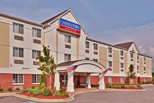 a hotel with a sign that reads grand hotel motel at Candlewood Suites Olive Branch by IHG in Olive Branch