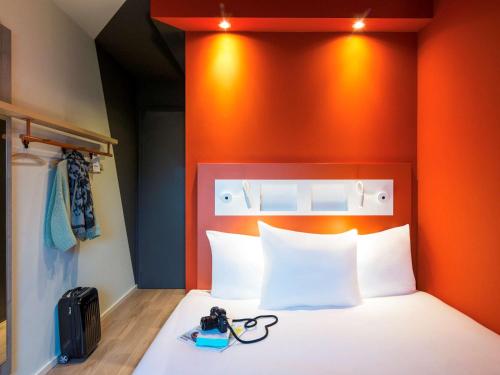 Giường trong phòng chung tại ibis budget Rotterdam The Hague Airport