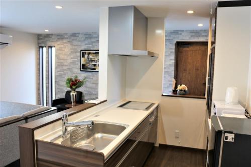 Kuchyň nebo kuchyňský kout v ubytování E-horizon Resort コンドミニアム名護D