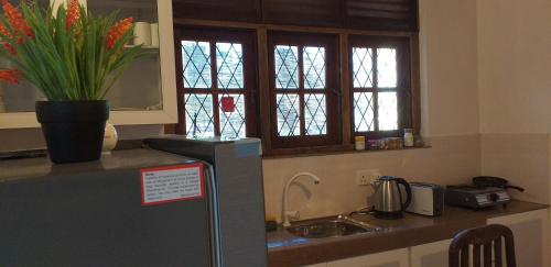 Dapur atau dapur kecil di Sisanda Residence