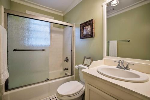 a bathroom with a toilet and a sink and a shower at Savannah Cottage - 5 Mi to Wormsloe Historic Site! in Savannah