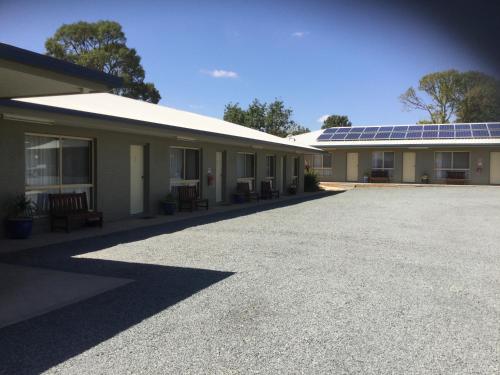 a building with a lot of solar panels on it at Sunrise Motel in Barooga
