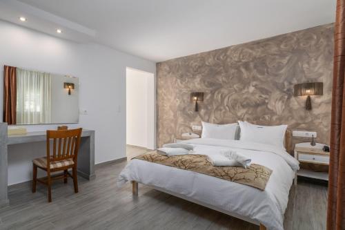 Ένα ή περισσότερα κρεβάτια σε δωμάτιο στο Ξενοδοχείο Πορτιανή