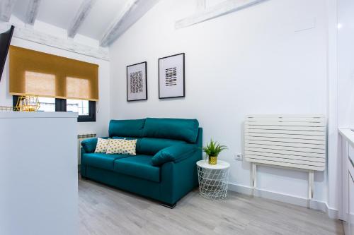 Χώρος καθιστικού στο Apartamentos Hervás Suites