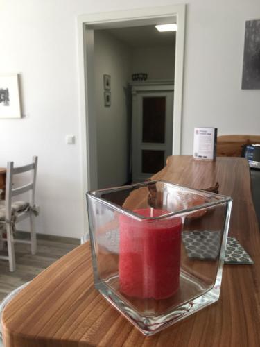 a glass bowl on top of a wooden table at Schönblick in Pfronten