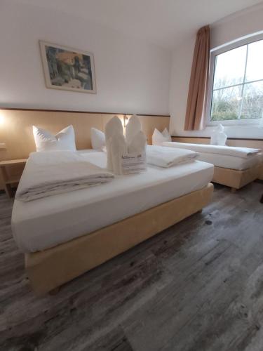 two large beds in a room with at Hotel Montana Limburg in Limburg an der Lahn
