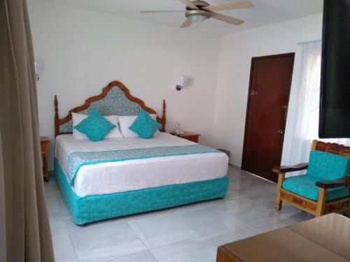 Hotel Posada Quinta Las Floresにあるベッド