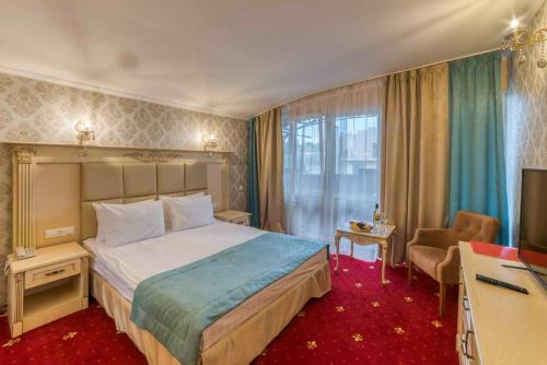 Кровать или кровати в номере Kras Hotel Resort & Spa