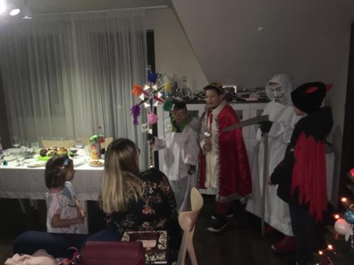a group of people dressed in costumes standing in a room at Apartamenty Pod Łysicą & SPA - przy stoku, basen, jacuzzi, sauna in Krajno Pierwsze