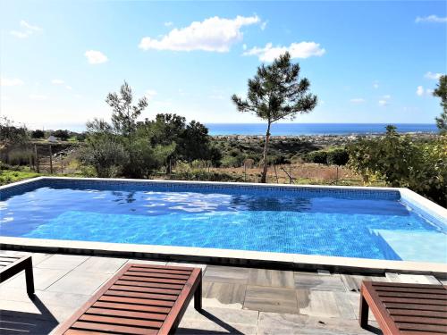 a swimming pool with a view of the ocean at Villa Gavriel - Peyia Villa With Breathtaking Sea View, Peyia Villa With Private Pool, Secluded, Huge Outdoor Space, Mountain Views in Peyia