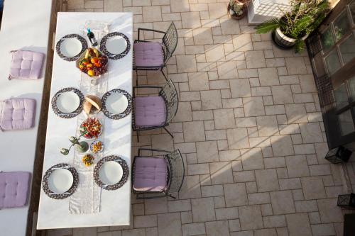 an overhead view of a table with rings and flowers at Medieval Dreams Villa in Rhodes Town
