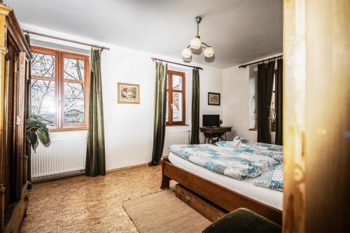 Postel nebo postele na pokoji v ubytování Statek Luníkov